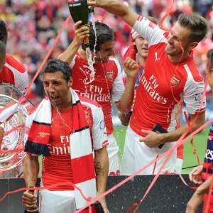 Aaron Ramsey and Santi Cazorla (Arsenal) celebrate winning the community shield. Arsenal 3 Aaron Ramsey and Santi Cazorla (Arsenal) celebrate winning the community shield. Arsenal 3