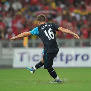 Aaron Ramsey shoots past Malaysia goalkeeper Khairul Che Mat to score the 1st Arsenal goal Aaron Ramsey shoots past Malaysia goalkeeper Khairul Che Mat to score the 1st Arsenal goal