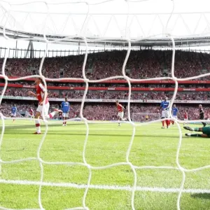 Aaron Ramsey shoots past Portsmouth goalkeeper David