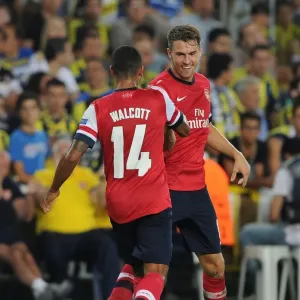 Aaron Ramsey and Theo Walcott Celebrate Goals: Arsenal's Dominance over Fenerbahce in 2013-14 UEFA Champions League Play-offs