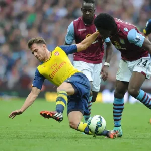 Aaron Ramsey vs. Carlos Sanchez: Intense Battle in Aston Villa vs. Arsenal Premier League Clash