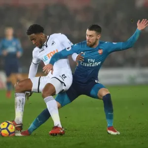 Aaron Ramsey vs. Leroy Fer: Intense Tackle in Swansea City vs. Arsenal Premier League Clash Aaron Ramsey vs. Leroy Fer: Intense Tackle in Swansea City vs. Arsenal Premier League Clash