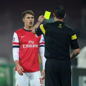 Aaron Ramsey Yellow Carded by Referee Viktor Kassai in Napoli v Arsenal UEFA Champions League Match Aaron Ramsey Yellow Carded by Referee Viktor Kassai in Napoli v Arsenal UEFA Champions League Match