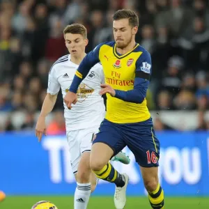 Aaron Ramsey's Sneaky Moves: Outsmarting Tom Carroll in Swansea Derby Aaron Ramsey's Sneaky Moves: Outsmarting Tom Carroll in Swansea Derby