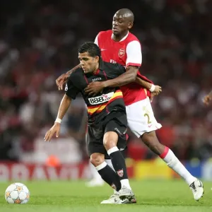Abou Diaby (Arsenal) Daniel Alves (Sevilla)