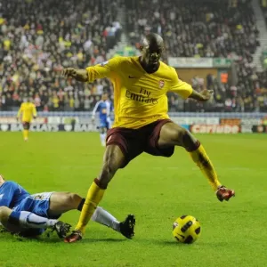Abou Diaby (Arsenal) Ronnie Stam (Wigan). Wigan Athletic 2: 2 Arsenal, DW Stadium