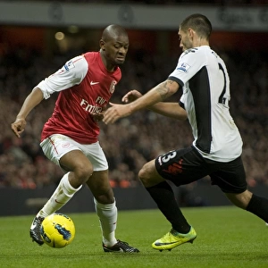 Abou Diaby of Arsenal takes on Clint Dempsey of Fulham during the Barclays Premier League match between Arsenal and Fulham at Emirates Stadium on November 26, 2011 in London, England. Credit; Arsenal