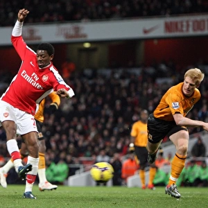 Abou Diaby scores Arsenals 3rd goal under pressure from Paul McShane (Hull)
