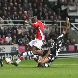 Abou Diaby shoots past Newcastle goalkeeper Steve Harper