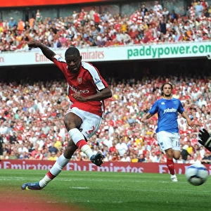 Abou Diaby shoots past Portsmouth goalkeeper David