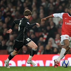 Abou Diaby and Thomas Carroll Clash in Arsenal's 5-0 FA Cup Victory over Leyton Orient