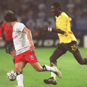 Adebayor's Double: Hamburg's 1-2 Defeat to Arsenal in Champions League Group G