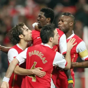 Adebayor's Dramatic Goal: Arsenal Stars Celebrate in the Quarters vs. Liverpool, UEFA Champions League
