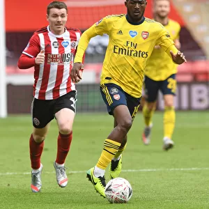 Ainsley Maitland-Niles in Action: Arsenal's FA Cup Quarterfinal Battle against Sheffield United