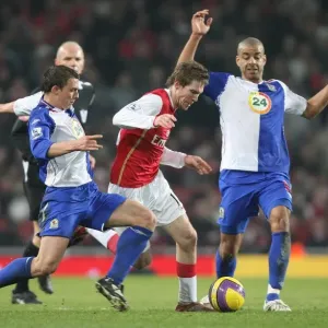 Alex Hleb (Arsenal) Stephen Warnock and Stephen Reid (Blackburn Rovers) Alex Hleb (Arsenal) Stephen Warnock and Stephen Reid (Blackburn Rovers)