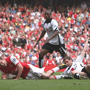 Alex Hleb is brought down for a penalty by Fulham defender Moritz Volz
