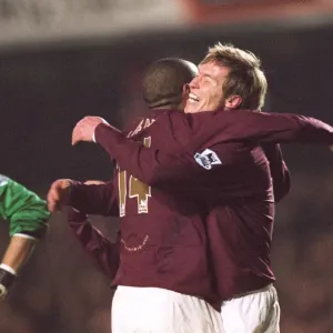Alex Hleb celebrates scoring Arsenals 7th goal with Thierry Henry