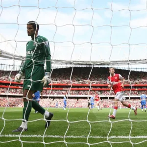 Alex Hleb and Cesc Fabregas celebrate the 1st Arsenal goal scored by Emmanuel Adebayor