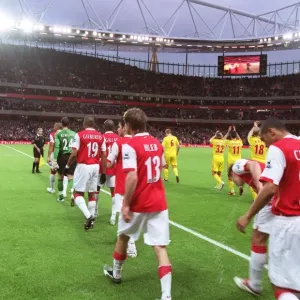 Alex Hleb and Gael Clichy (Arsenal) walk out with the team onto the pitch