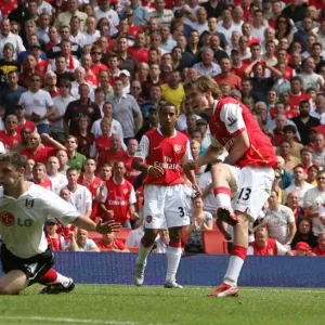 Alex Hleb scores past Chris Baird in Barclays Premier League action