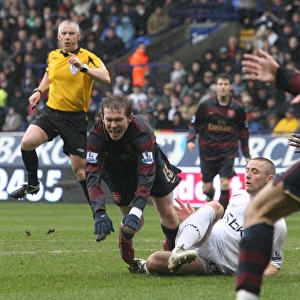 Alex Hleb is tripped by Bolton defender Gary Cahill for the Arsenal penalty