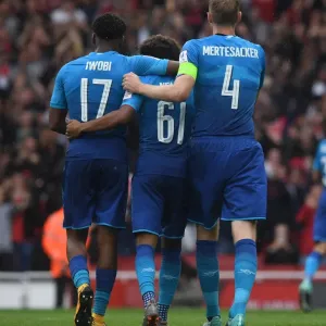 Alex Iwobi and Per Mertesacker congratulate Reiss Nelson on his assist. Arsenal 5 Alex Iwobi and Per Mertesacker congratulate Reiss Nelson on his assist. Arsenal 5