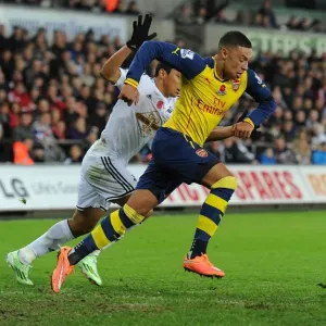 Alex Oxlade-Chamberlain Outmaneuvers Jefferson Montero in Swansea v Arsenal Premier League Clash