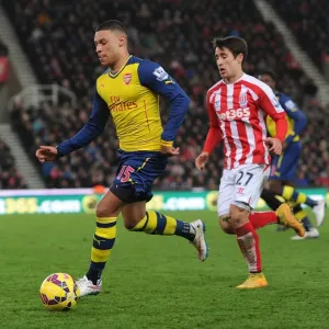 Alex Oxlade-Chamberlain's Sneaky Move: Outsmarting Bojan in the Stoke City vs. Arsenal Clash (2014-15) Alex Oxlade-Chamberlain's Sneaky Move: Outsmarting Bojan in the Stoke City vs. Arsenal Clash (2014-15)