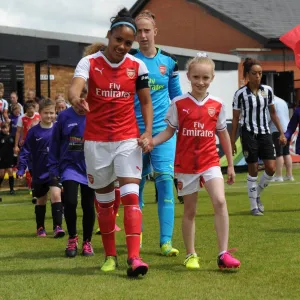 Alex Scott (Arsenal Ladies) and the mascot before the match