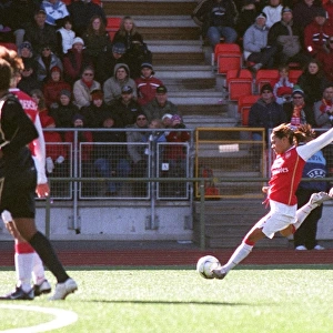 Alex Scott scores Arsenals goal under pressure from Lise Klaveness (Umea)
