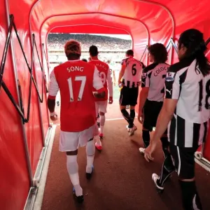 Alex Song (Arsenal) and Fabricio Coloccini (Newcastle) walk out of the players tunnel Alex Song (Arsenal) and Fabricio Coloccini (Newcastle) walk out of the players tunnel