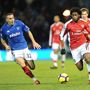 Alex Song (Arsenal) Hassan Yebda (Portsmouth). Portsmouth 1: 4 Arsenal, Barclays Premier League