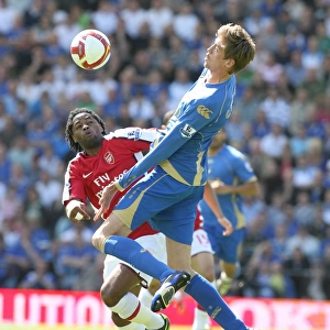 Alex Song (Arsenal) Peter Crouch (Portsmouth)