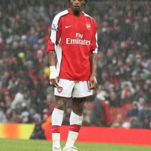 Alex Song (Arsenal) stands in the rain