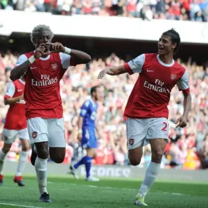 Alex Song celebrates scoring the 3rd Arsenal goal with Marouane Chamakh
