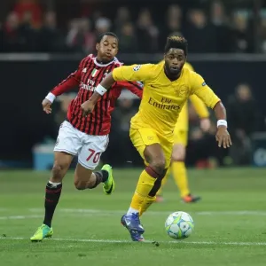 Alex Song Outmaneuvers Robinho: A Moment from the AC Milan vs. Arsenal UEFA Champions League Clash, 2012 Alex Song Outmaneuvers Robinho: A Moment from the AC Milan vs. Arsenal UEFA Champions League Clash, 2012
