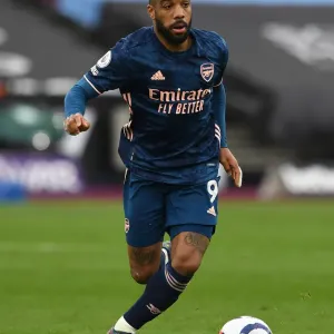 Alexandre Lacazette in Action: Arsenal vs. West Ham United - Premier League Showdown Alexandre Lacazette in Action: Arsenal vs. West Ham United - Premier League Showdown