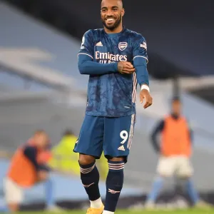 Alexis Lacazette Faces Manchester City at Empty Etihad Stadium during the 2020-21 Premier League Match