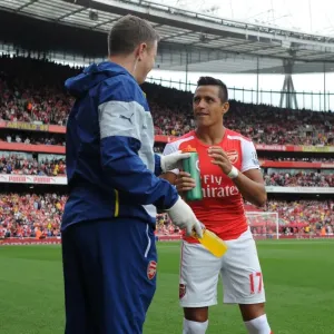 Alexis Sanchez (Arsenal) with Arsenal Physio Colin Lewin before the match. Arsenal 2