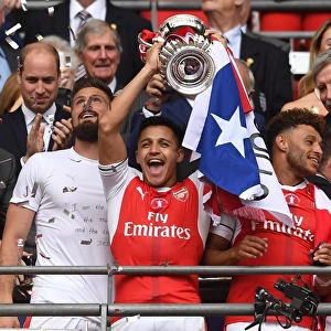 Alexis Sanchez (Arsenal) lifts the FA Cup