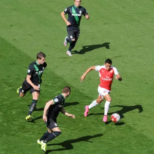 Alexis Sanchez (Arsenal) takes on Xherdan Shaqiri, Marco van Ginkel and Phil Bardsley