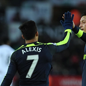 Alexis Sanchez celebrates scoring Arsenals 4th goal with Mesut Ozil. Swansea City 0