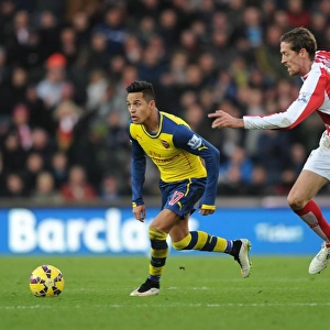 Alexis Sanchez Outmaneuvers Peter Crouch: A Moment from the Stoke City vs. Arsenal Premier League Clash (2014-15)