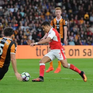 Alexis Sanchez scores his 2nd goal for Arsenal beating Harry McGuire (Hull) on the way Alexis Sanchez scores his 2nd goal for Arsenal beating Harry McGuire (Hull) on the way