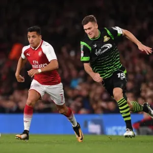 Alexis Sanchez vs. Joe Wright: Arsenal's Star Forward Clashes with Doncaster's Defender in Carabao Cup Showdown