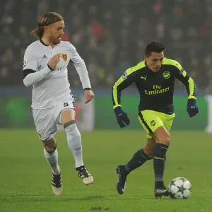 Alexis Sanchez vs Michael Lang: A Football Battle in the 2016-17 UEFA Champions League: FC Basel vs Arsenal Alexis Sanchez vs Michael Lang: A Football Battle in the 2016-17 UEFA Champions League: FC Basel vs Arsenal