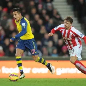 Alexis Sanchez's Mesmerizing Skill: Outmaneuvering Marc Muniesa in the Stoke City vs. Arsenal Clash (2014-15) Alexis Sanchez's Mesmerizing Skill: Outmaneuvering Marc Muniesa in the Stoke City vs. Arsenal Clash (2014-15)