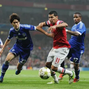 Andre Santos vs. Atsuto Uchida and Jefferson Farfan: Arsenal's Battle in the Champions League Andre Santos vs. Atsuto Uchida and Jefferson Farfan: Arsenal's Battle in the Champions League