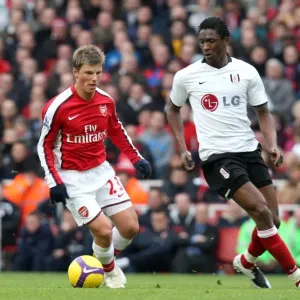 Andrey Arshavin (Arsenal) Dickson Etuhu (Fulham) Andrey Arshavin (Arsenal) Dickson Etuhu (Fulham)