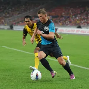 Andrey Arshavin (Arsenal) Helmi Remeli (Malaysia). Malaysia XI 0: 4 Arsenal Andrey Arshavin (Arsenal) Helmi Remeli (Malaysia). Malaysia XI 0: 4 Arsenal